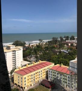 a view of a city with buildings and the ocean at Homestay Kuala Terengganu Baroqah Homestay in Kuala Terengganu
