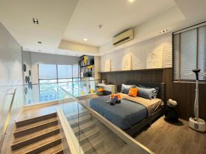a bedroom with a bed and a balcony at X - The Library Icon City Petaling Jaya Subang Airport in Sungai Way