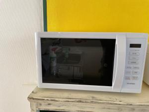 TV o dispositivi per l'intrattenimento presso 一棟貸し宿ゲストハウスサンク