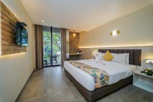 Postel nebo postele na pokoji v ubytování Hotel Citrus Prime Candolm, Goa