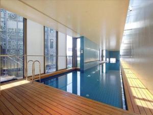 a swimming pool in the middle of a building at Sky High Luxury, Panoramic Views in Melbourne