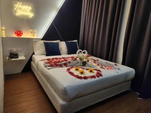 Postel nebo postele na pokoji v ubytování Rica Hotel Usj