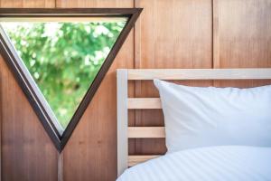 Llit o llits en una habitació de PINECONE BASE