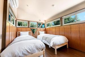 Llit o llits en una habitació de PINECONE BASE