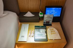 Uma cama ou camas num quarto em Qiuguo Hotel Beijing Convention Center Bird's Nest Beiyuan
