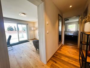 a hallway with a living room and a bedroom at Ferienhaus DONAUzeit in Sigmaringen