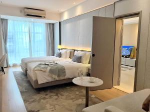Postel nebo postele na pokoji v ubytování Somerset Haizhu Centre Guangzhou