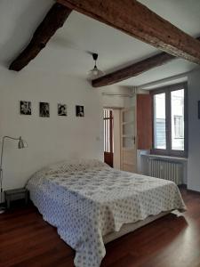 a bedroom with a white bed in a room at Del Nobile Apartment II in Turin