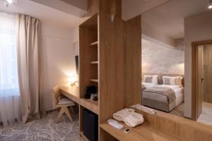 Postel nebo postele na pokoji v ubytování Hotel Serenity Timisoara