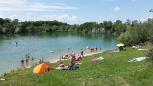 a group of people on the beach at a lake at Marinela's BnB in Vienna
