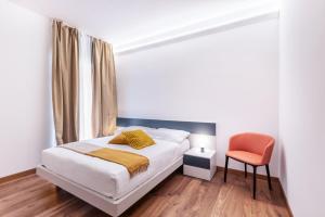 Voodi või voodid majutusasutuse JOIVY Cavour Luxury Apartments toas