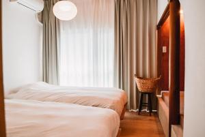 Letto o letti in una camera di Tipy records inn photon