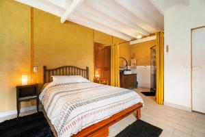 Postel nebo postele na pokoji v ubytování Gîte de Carhalo