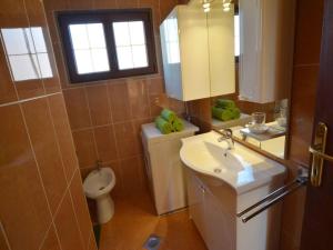 a bathroom with a sink and a toilet and a window at Apartment Kuftic - Relax Zone - Quiet Street in Rovinj +37 photos