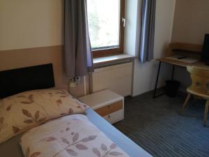 Voodi või voodid majutusasutuse Gasthaus Schachinger toas
