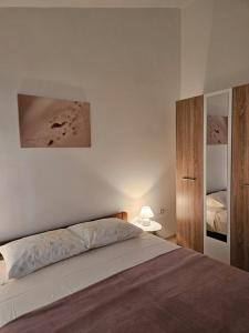 Postel nebo postele na pokoji v ubytování Lorena Apartments in Pula