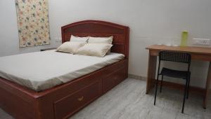 Кровать или кровати в номере Carmel Stay Rooms