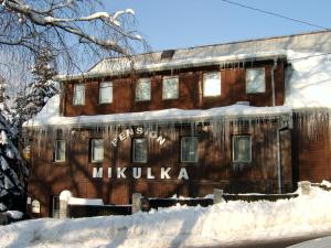 a building with the words mikulska written on it at Pension Mikulka in Mikulov v Krušných Horách