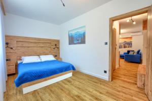 Łóżko lub łóżka w pokoju w obiekcie Westa Apartamenty