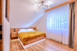 Łóżko lub łóżka w pokoju w obiekcie Westa Apartamenty