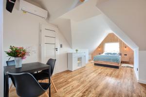 Łóżko lub łóżka w pokoju w obiekcie Westa Apartamenty