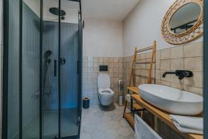 a bathroom with a sink and a shower and a toilet at Bohemian Experience in Prague +65 photos