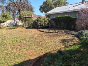 a yard with a gazebo and a house at Botterblom 1 in Middelburg