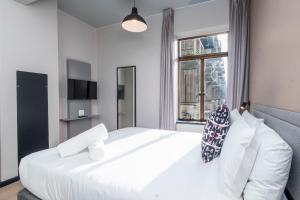 Postel nebo postele na pokoji v ubytování HAVN Aparthotel by Totalstay