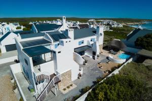 an aerial view of a white house with the ocean at Dreamcatcher Lavender in Paternoster
