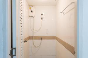 a bathroom with a shower with a shower head at BW Thai Art Style Hotel in Bangkok +156 photos