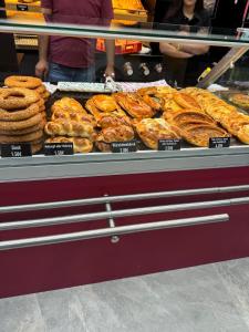 a display case with lots of different types of pastries at Stadtpension Heilbronn in Heilbronn