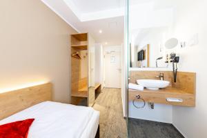 Um banheiro em Maingau Hotel