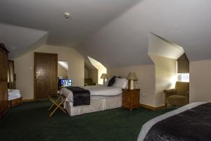 Voodi või voodid majutusasutuse Percy French Hotel toas