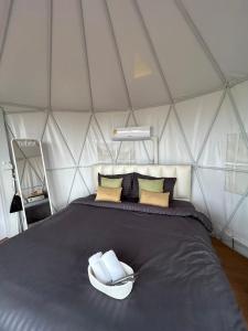 Postel nebo postele na pokoji v ubytování Fulfield Cafe&Resort