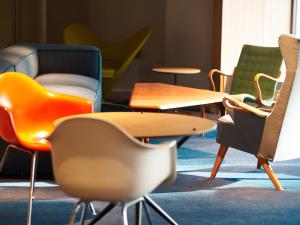 a group of chairs and tables in a room at WPÜ HOTEL Shinjuku in Tokyo