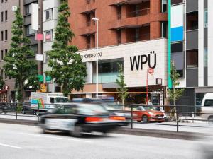 a group of cars driving down a city street at WPÜ HOTEL Shinjuku in Tokyo