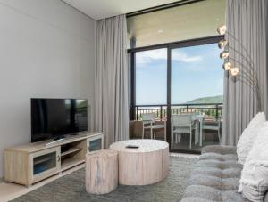 TV a/nebo společenská místnost v ubytování Zimbali Suites 602 + 3 fotografie