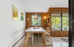 a dining room with a table and chairs at 2 Bedroom Lovely Home In Frederiksværk in Frederiksværk