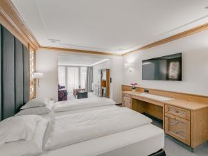 Łóżko lub łóżka w pokoju w obiekcie Gourmet & Wine Hotel Austria - 4 Sterne superior