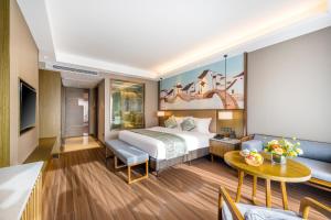 Postel nebo postele na pokoji v ubytování Millennium Resort Wuyishan