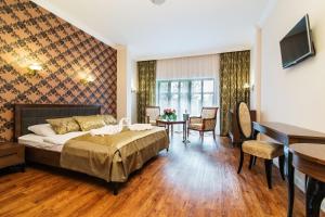 Łóżko lub łóżka w pokoju w obiekcie Pałac Margot Nature&SPA