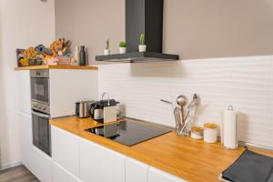 a kitchen with a counter with a stove top oven at Casa Mirella in Cavallino-Treporti