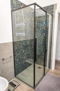 a shower with a glass door in a bathroom at Casa Mirella in Cavallino-Treporti +37 photos