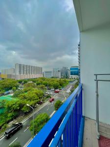 a view of a city street from a balcony at Moa Sea Residences Staycation in Manila