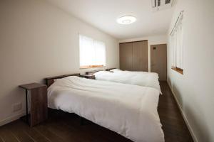 Postel nebo postele na pokoji v ubytování 禅ZEN Retreat Toyama