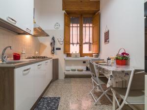 a kitchen with a sink and a table in it at Homeboutique in Cagliari