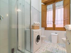 a bathroom with a washing machine and a toilet at Homeboutique in Cagliari +20 photos