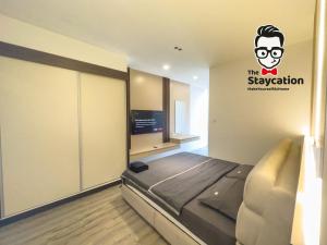TV/trung tâm giải trí tại Staycation Homestay 58 Podium Apartment