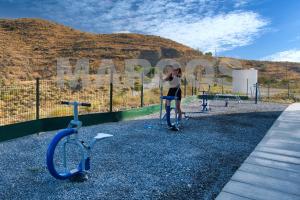 a woman is standing next to two exercise bikes at Isea & Sun Calaceite in Torrox Costa