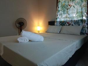 Postel nebo postele na pokoji v ubytování Fitz & Oritz Homestay